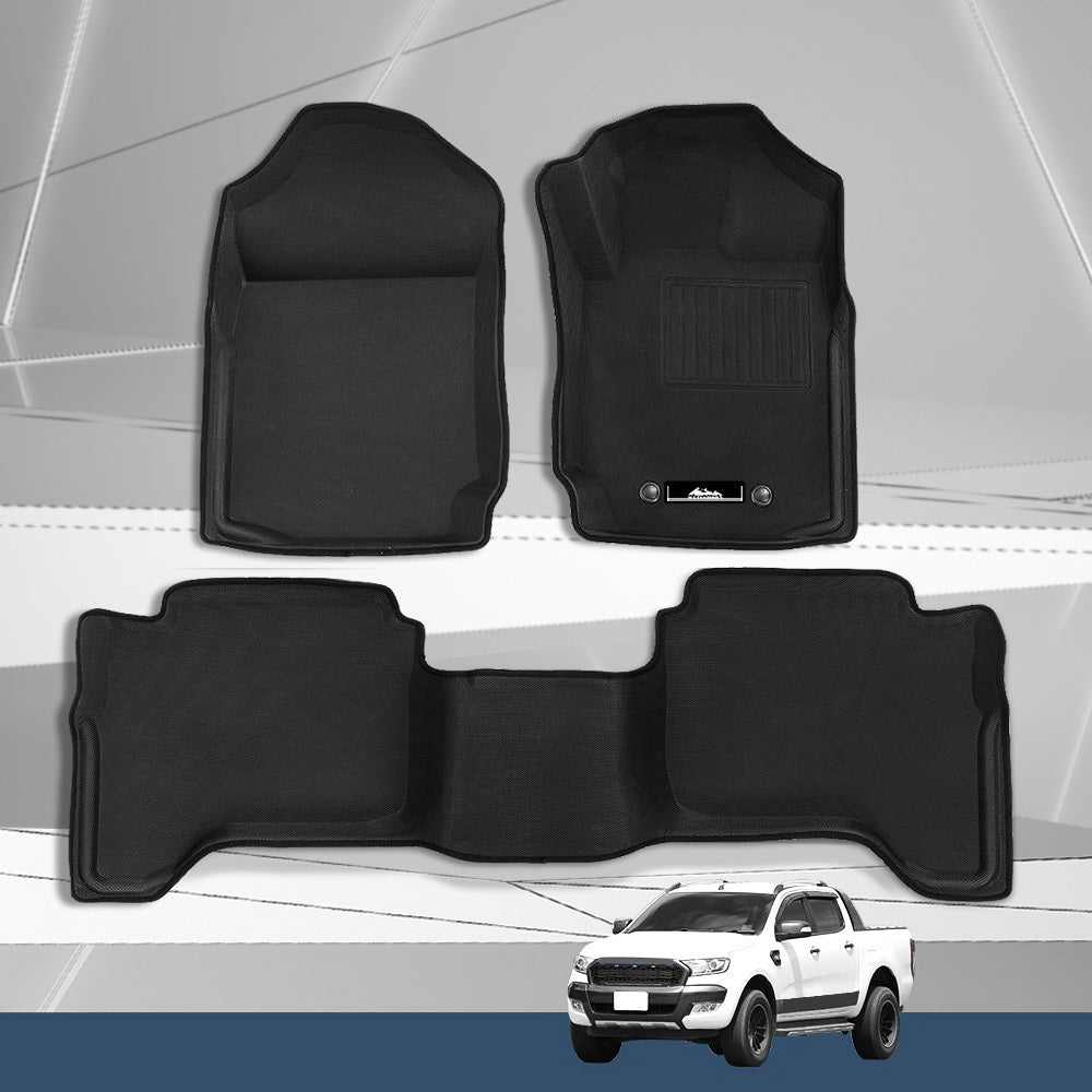 Black car floor mats with a white truck in the background
