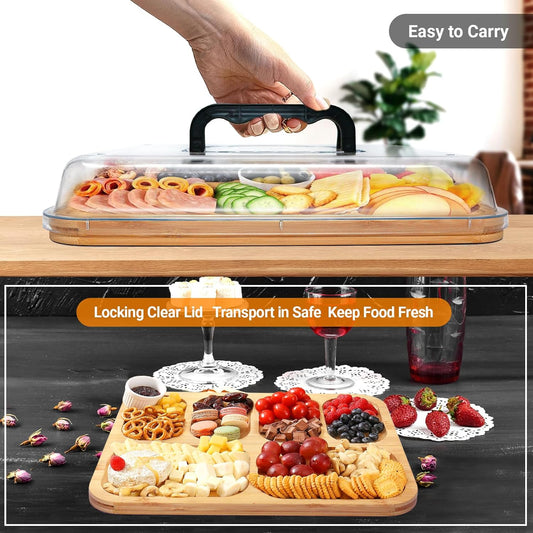 Food platter with a clear lid, filled with snacks and fruits, on a wooden surface.