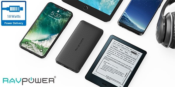 RAVPower power bank with smartphone, tablet, e-reader, and headphones on a white background