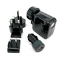 Set of black travel adapters including wall plug, car charger, and USB adapter on a white background