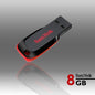 SanDisk USB flash drive with 8GB label on a reflective surface