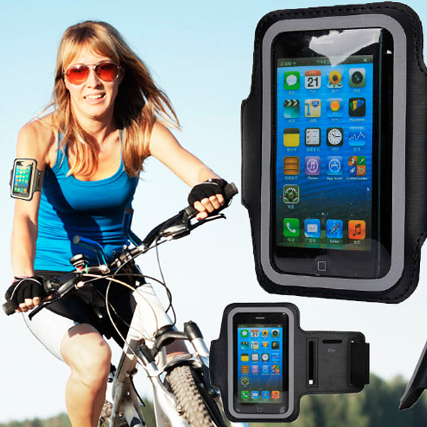 Woman riding a bike with smartphone armbands on, showing phone screen.