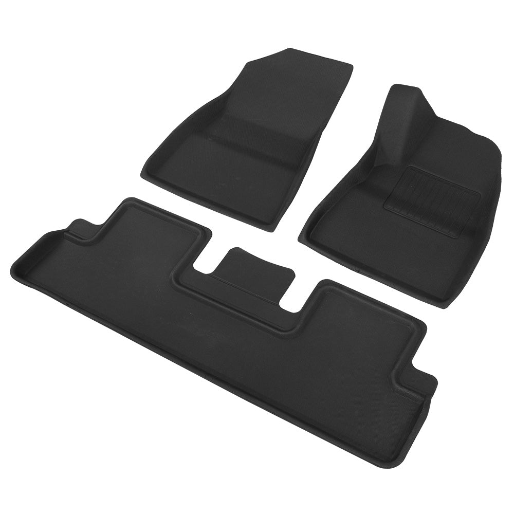 Set of black car floor mats on a white background