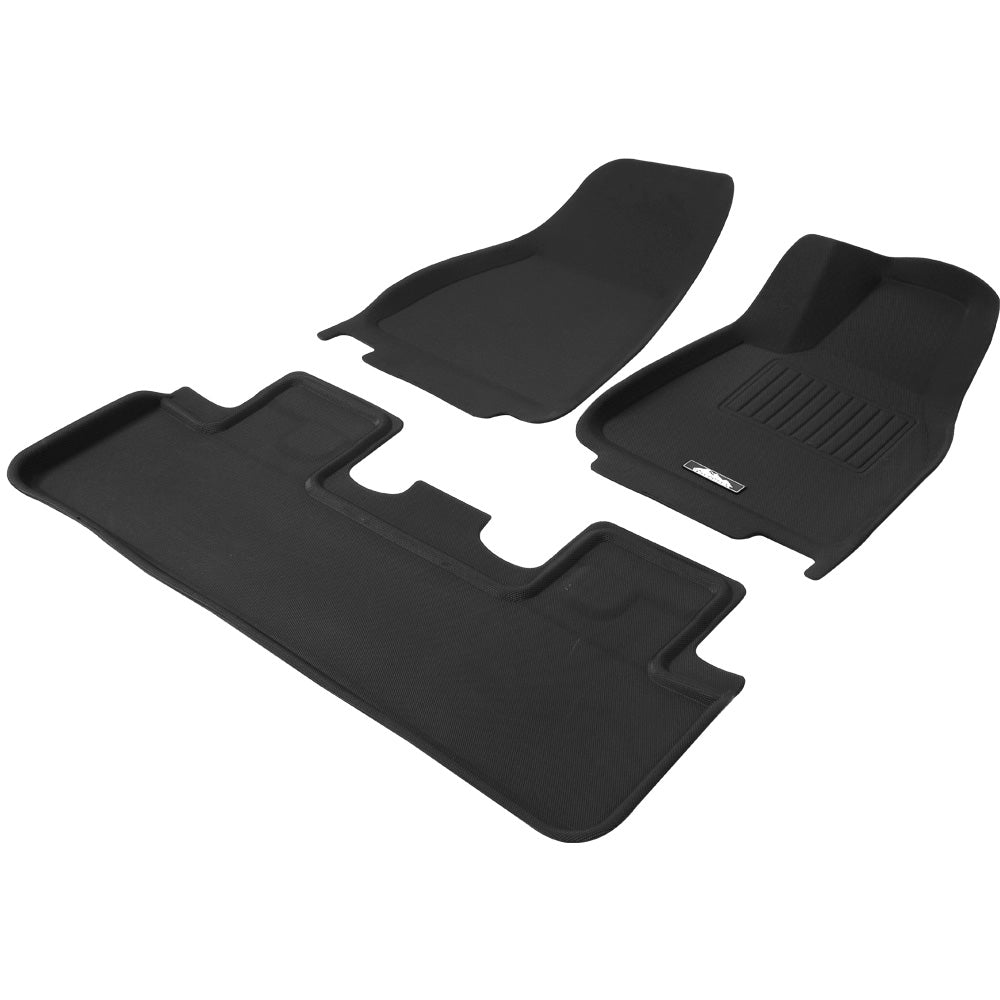 Set of black car floor mats on a white background