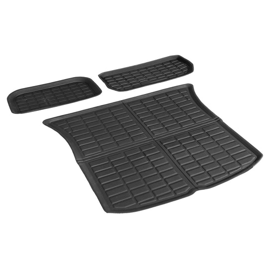 Set of black car floor mats on a white background