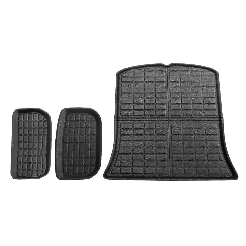 Set of black car floor mats on a white background