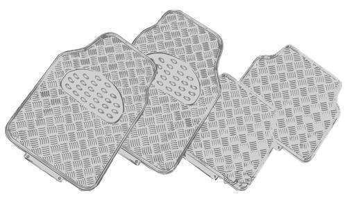 Set of four car mats with textured surface on a white background