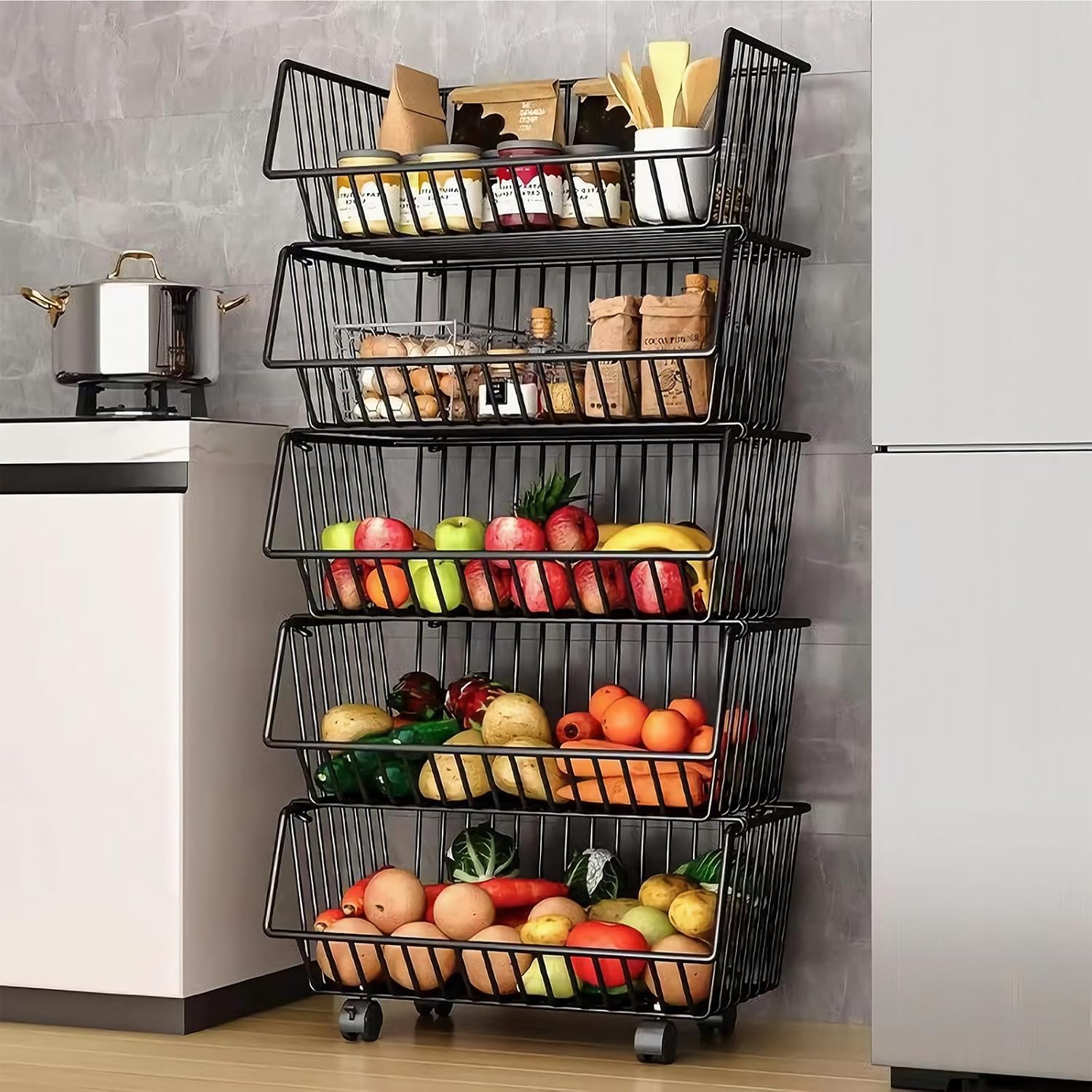 Multi-tiered metal basket organizer with fruits and vegetables in a kitchen setting.