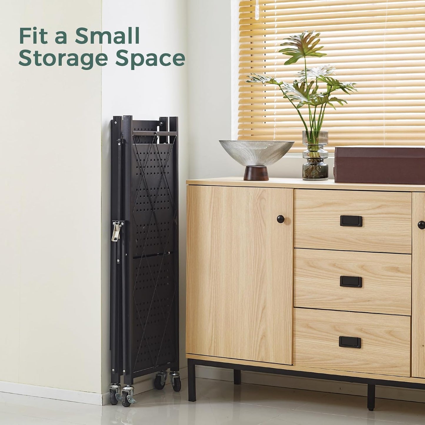 Small storage space solution with a black metal folding shelf next to a wooden cabinet.