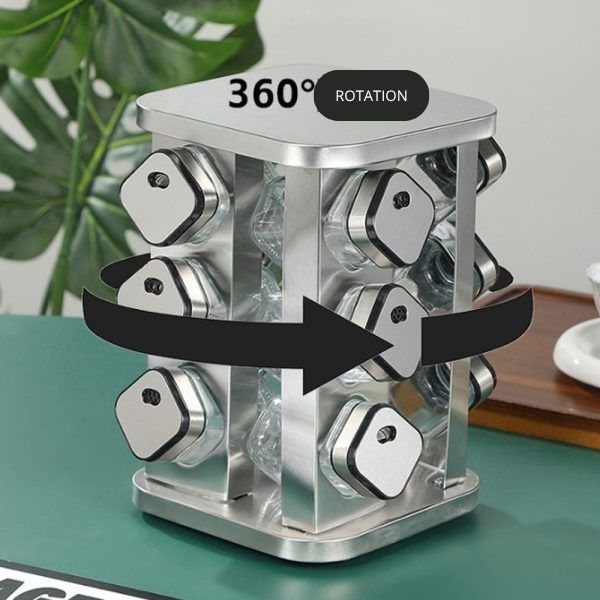 Metallic spice rack with 360-degree rotation feature on a green surface.