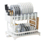 White dish rack with plates, glasses, and cutlery on a white background