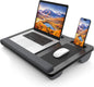 Laptop on a stand with a phone and mouse, both displaying mountain and lake scenery.
