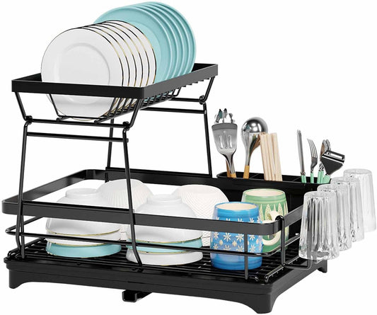 Black dish rack with dishes, cups, and utensils on a white background