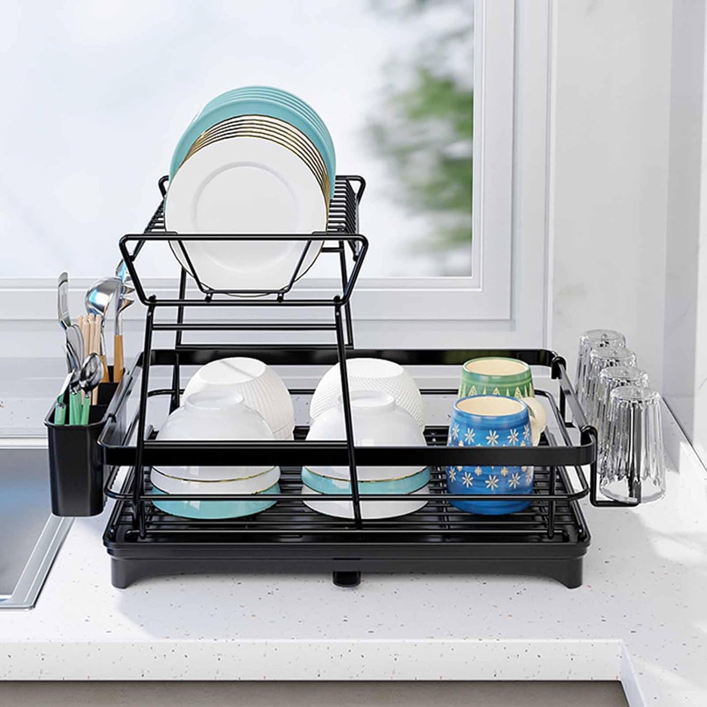 Black dish rack with dishes on a kitchen counter