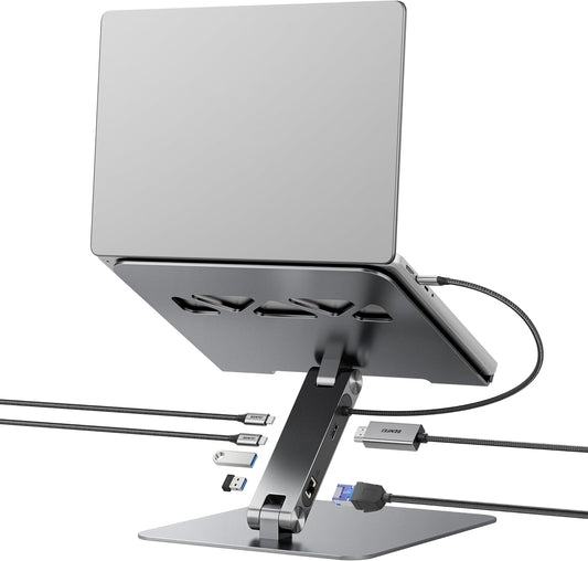 Laptop on a stand with multiple cables connected on a white background