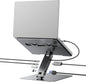 Laptop on a stand with multiple cables connected on a white background