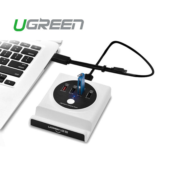 UGREEN USB hub connected to a laptop on a white background