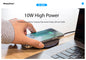 Person using a wireless charging pad with a smartphone on a desk next to a laptop, with PhotoFast branding.